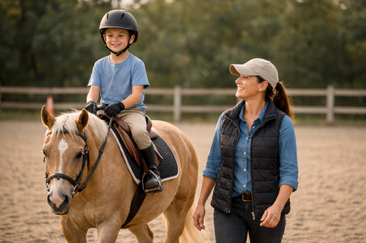 Child riding confidently in a properly fitted children’s horse saddle during a beginner lesson